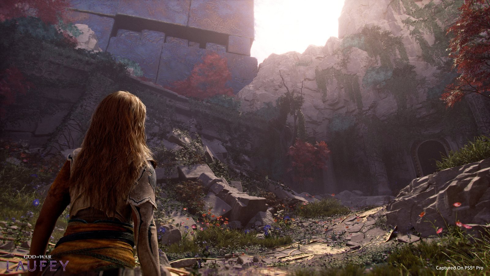 Faye diante da paisagem do Everywhen em God of War Laufey